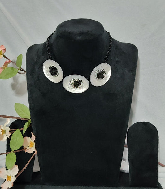 Modern Black and Silver Statement Necklace with Textured Discs